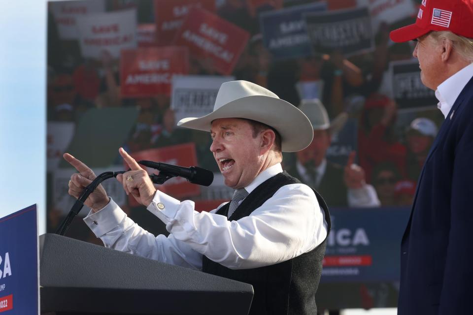 Former President Donald Trump listens as Nebraska gubernatorial candidate Charles Herbster speaks during a rally at the I-80 Speedway on May 01, 2022 in Greenwood, Nebraska.