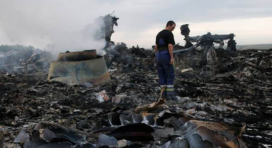 Investigators inspect the MH17 crash site. Photo: Reuters.