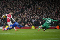 Arsenal's Kai Havertz, left, scores his side's third goal during the English Premier League soccer match between Arsenal and Chelsea at Emirates Stadium in London, Tuesday, April 23, 2024. (AP Photo/Kin Cheung)