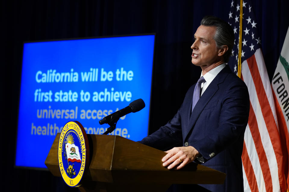 California Gov. Gavin Newsom unveils his proposed $286 billion 2022-2023 state budget during a news conference in Sacramento, Calif., Monday, Jan. 10, 2022. Newsom wants to make California the first state to cover everyone under its Medicaid plan regardless of their immigration status. (AP Photo/Rich Pedroncelli)