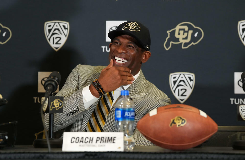 New Colorado Buffaloes head coach Deion Sanders reacts during his introductory press conference on Sunday.