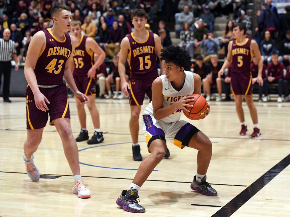 White River's Kendrell Cuevas keeps the ball away from De Smet players on Saturday, January 22, 2022, in the Hanson Classic at the Corn Palace in Mitchell.