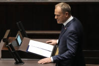 Newly elected Poland's Prime Minister Donald Tusk addresses lawmakers during his speech at the parliament in Warsaw, Poland, Tuesday Dec. 12, 2023. (AP Photo/Czarek Sokolowski)