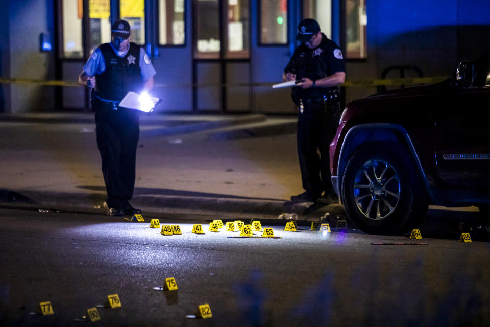 Chicago police investigate on the 800 block of South Karlov Avenue, where a 16-year-old girl was among five people seriously wounded in a shooting near Daniel Webster Elementary School in the Lawndale neighborhood on May 29, 2022. (Ashlee Rezin / Chicago Sun-Times via AP)