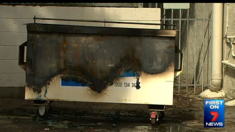 Police allege the woman also set fire to a dumpster in a nearby alleyway. Photo: 7 News