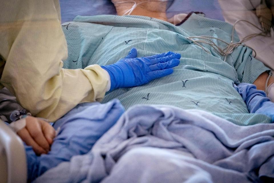 A nurse tends to a patient suspected of having COVID-19 in the intensive care unit at North York General Hospital in Toronto in May.