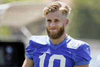 Los Angeles Rams wide receiver Cooper Kupp smiles during stretching at the NFL football team's practice facility, Thursday, May 26, 2022, in Thousand Oaks, Calif. (AP Photo/Marcio Jose Sanchez)