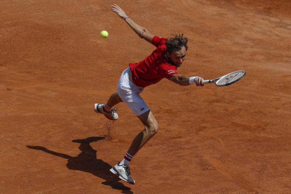 Russia's Daniil Medvedev returns the ball to fellow-countryman Aslan Karatsev during their match at the Italian Open tennis tournament, in Rome, Wednesday, May 12, 2021. Karatsev won 6-2, 6-4. (AP Photo/Alessandra Tarantino)