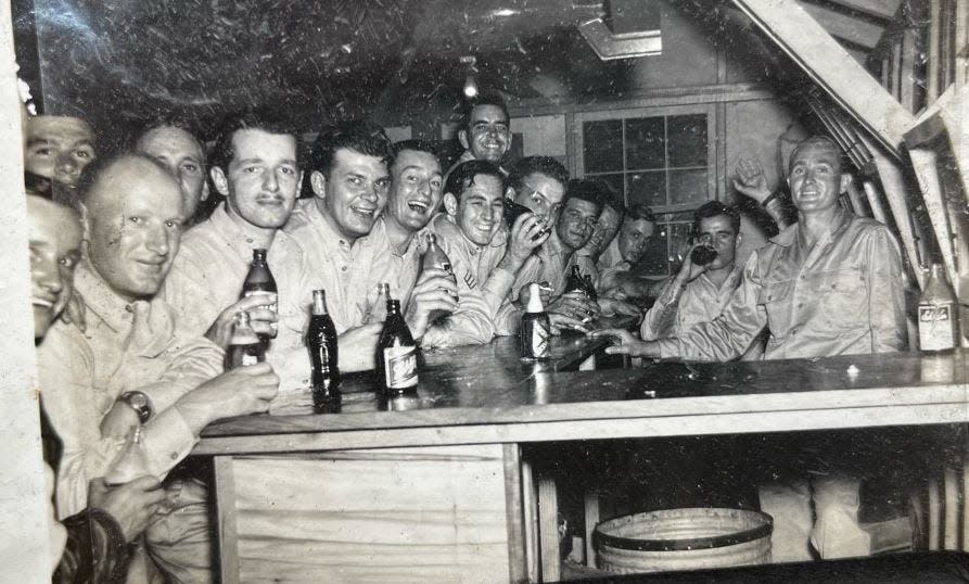 This photo of soldiers enjoying an evening off duty in the South Pacific islands of New Caledonia was among those found recently scattered along Atlanta Highway in Athens.