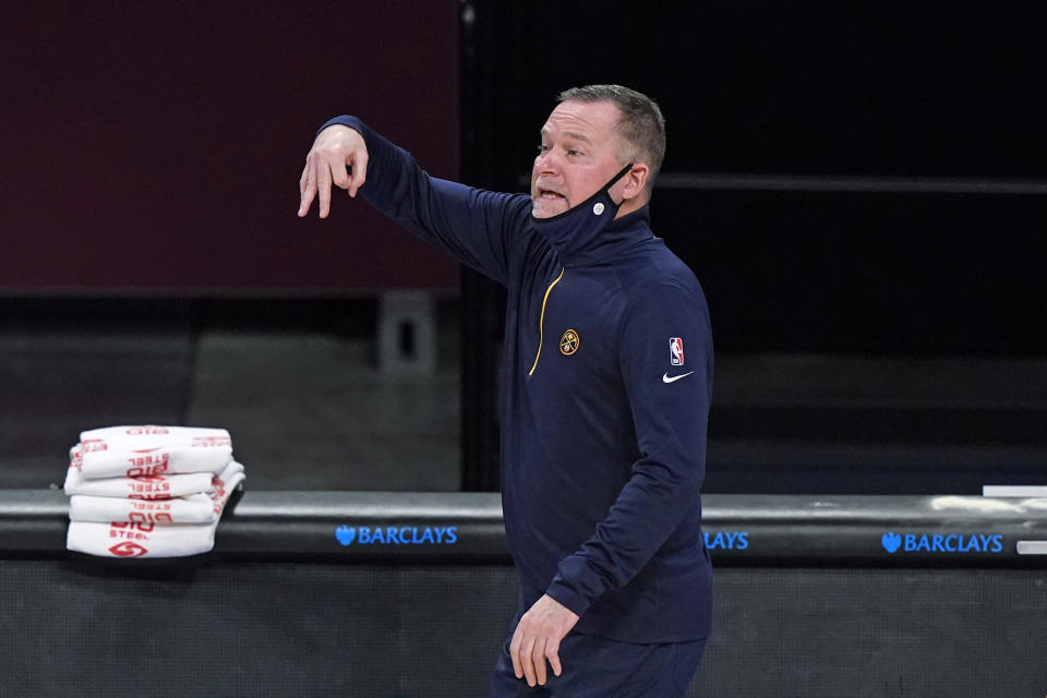 Denver Nuggets coach Michael Malone gestures during the second quarter of the team's NBA basketball game against the Brooklyn Nets, Tuesday, Jan. 12, 2021, in New York. (AP Photo/Kathy Willens)