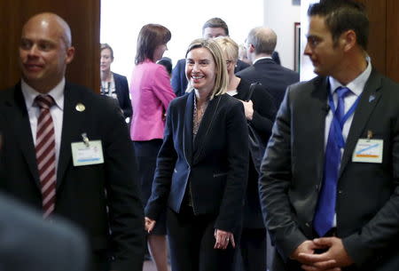 European Union foreign policy chief Federica Mogherini (C) arrives at a joint meeting of European Union foreign and defence ministers at the EU Council in Brussels, Belgium, May 18, 2015. REUTERS/Francois Lenoir