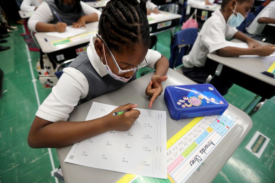 Amanda Oliver, a fourth grade student at Leadership Prep Canarsie, works on a math problem on Oct. 28. The school designs math instruction to be fast-paced, loud and collaborative so students stay engaged.