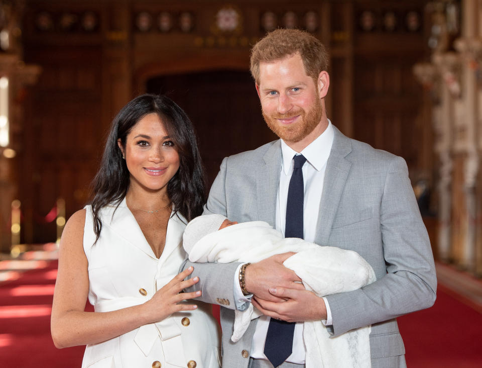 Prince Harry, Duke of Sussex and Meghan, Duchess of Sussex, pose with their newborn son Archie Harrison Mountbatten-Windsor during a photocall in St George's Hall at Windsor Castle on May 8, 2019 in Windsor, England. The Duchess of Sussex gave birth at 05:26 on Monday 06 May, 2019.