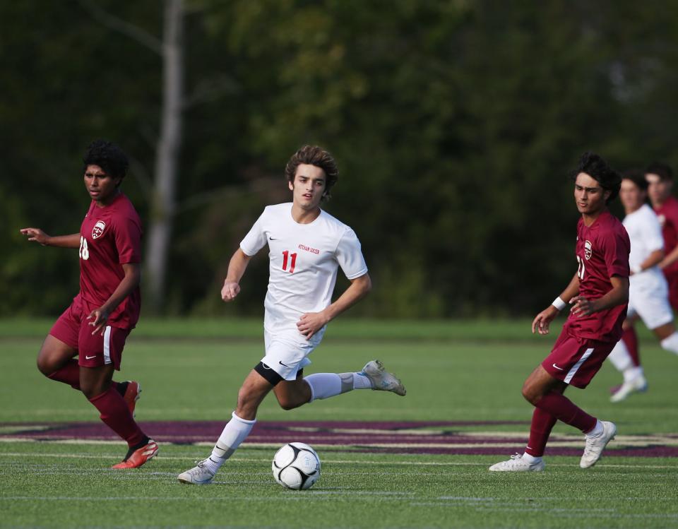 Ketcham's Ryan Zindler looks to move the ball upfield against Arlington during a Sept. 28, 2022 boys soccer game.