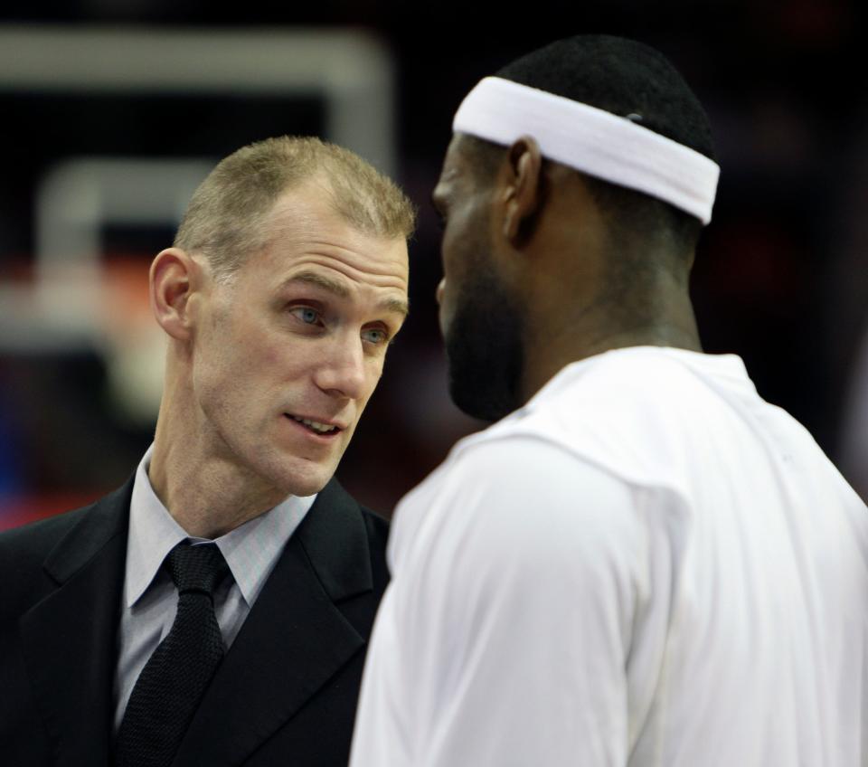 Cleveland Cavaliers assistant coach Chris Jent, left, talks to LeBron James, right, in a timeout during a NBA basketball game against the Memphis Grizzlies at Quicken Loans Arena in Cleveland, February 24, 2009.