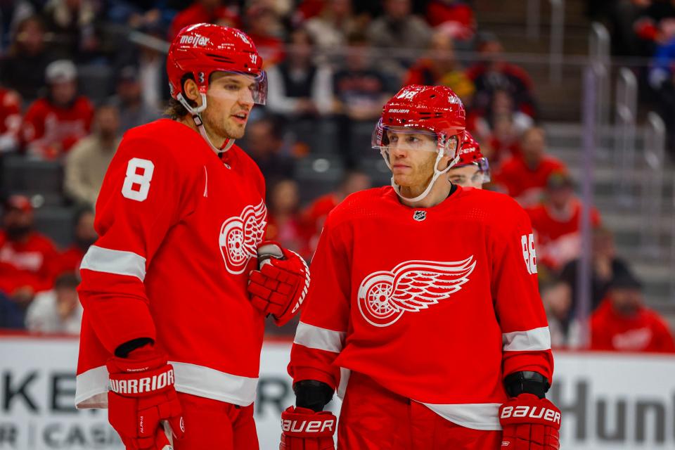 Detroit Red Wings right wing Patrick Kane (88) talks with defenseman Ben Chiarot (8) during the first period at Little Caesars Arena in Detroit on Thursday, Dec. 7, 2023.