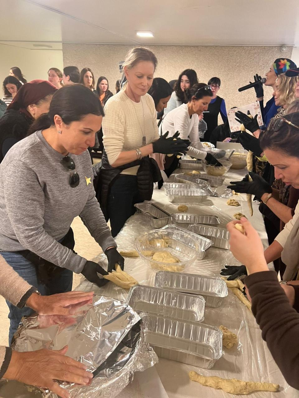 Women's Israel Mission participants attended a challah bake for women who were evacuated from their homes in southern Israel and are living temporarily in the Talbiya neighborhood in Jerusalem.