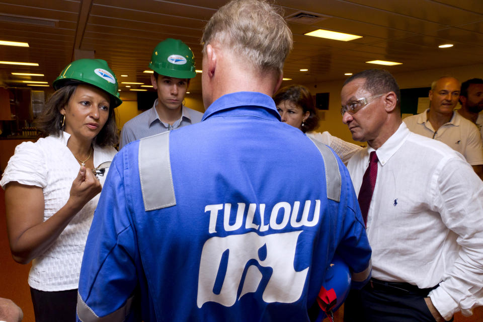 French Overseas Minister Marie-Luce Penchard (L) speaks with Tullow Oil company employees during a visit of an offshore oil platform on September 17, 2011 off the coasts of the French overseas department of Guiana. Anglo Dutch energy giant Shell announced on September 9, 2011 that it had discovered oil in deep waters around 150 kilometres (90 miles) off the coast of French Guiana following a joint venture drilling project with venture energy partners Total, Tullow and Northpet. AFP PHOTO / JODY AMIET (Photo credit should read JODY AMIET/AFP via Getty Images)