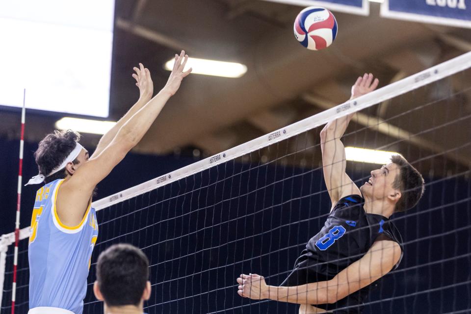 Brigham Young Cougars middle blocker Caleb Sorenson (8) jumps to hit the ball during an NCAA men’s volleyball match against the Long Island Sharks at the Smith Fieldhouse in Provo on Thursday, Feb. 8, 2023. | Marielle Scott, Deseret News