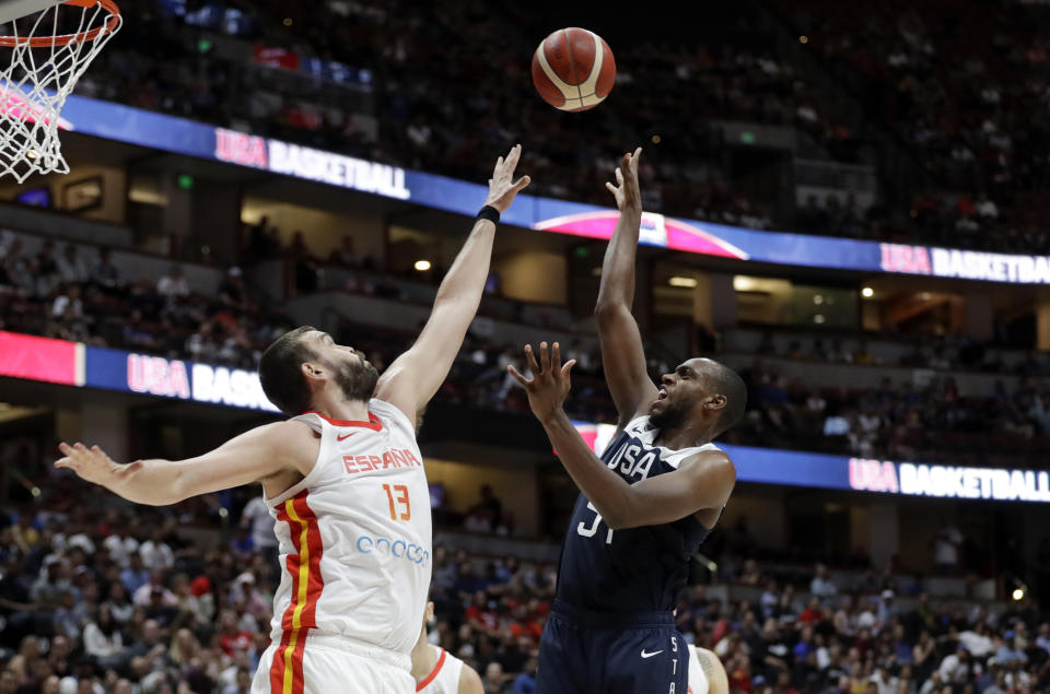 United States' Khris Middleton, right, shoots over Spain's Marc Gasol during the second half of an exhibition basketball game Friday, Aug. 16, 2019, in Anaheim, Calif. (AP Photo/Marcio Jose Sanchez)