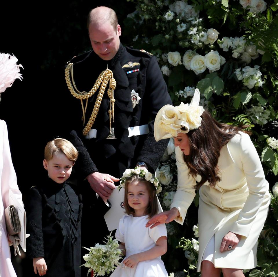 Princess Charlotte on the Duke of Duchess of Sussex's wedding day, with her parents and brother, Prince George. Tom Bower writes about an oft-repeated incident involving a bridesmaid dress fitting - Jane Barlow/Getty Images