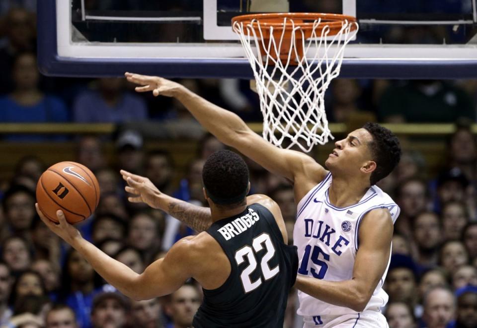 Duke's Frank Jackson defends Michigan State's Miles Bridges. (AP)