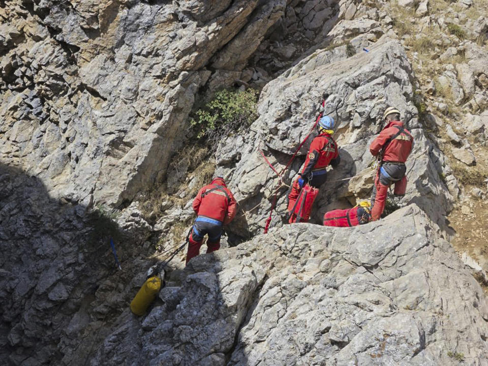 European Cave Rescue Association (ECRA) members work next to the entrance of Morca cave near Anamur, southern Turkey, Thursday, Sept. 7, 2023. Turkish and international cave rescue experts are working to save an American speleologist trapped at a depth of more than 1,000 meters (3,280 feet) in a cave in southern Turkey after he became ill. (Mithat Unal/Dia Images via AP)