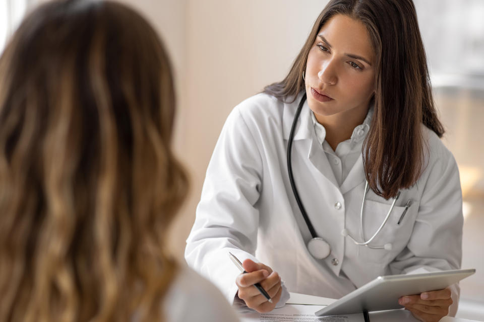 A doctor talking with a patient