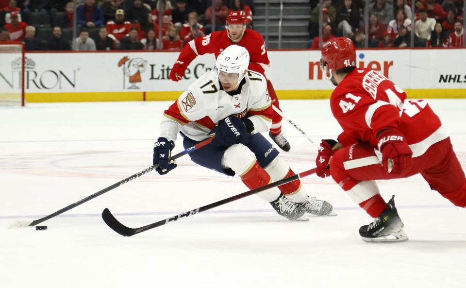 Florida Panthers center Evan Rodrigues (17) skates against Detroit Red Wings defenseman Shayne Gostisbehere (41) during the second period of an NHL hockey game Saturday, March 2, 2024, in Detroit. (AP Photo/Duane Burleson)