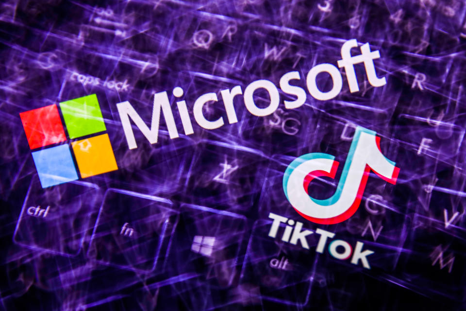 TikTok and Microsoft logos displayed on a screen and  keyboard are seen in this multiple exposure illustration photo taken on August 3, 2020. Microsoft is interested in purchase TikTok platform in the United States. (Photo Illustration by Jakub Porzycki/NurPhoto via Getty Images)