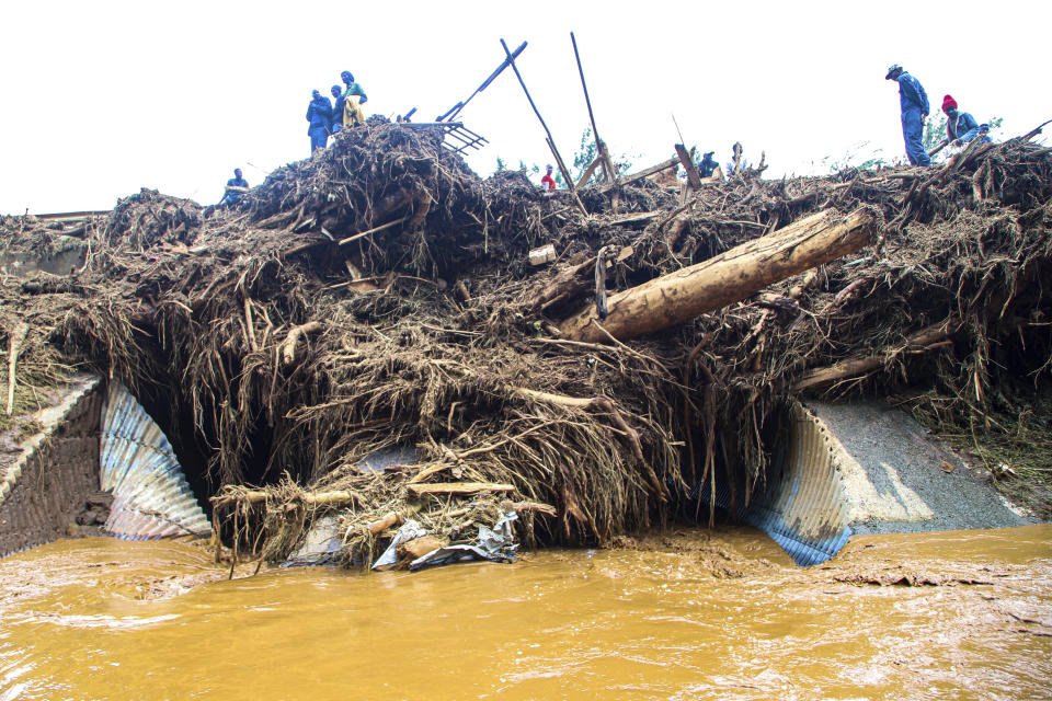 People try to clear the area after a dam burst, in Kamuchiri Village Mai Mahiu, Nakuru County, Kenya, Monday, April 29, 2024. Kenya's Interior Ministry says at least 45 people have died and dozens are missing after a dam collapsed following heavy rains. (AP Photo/Patrick Ngugi)