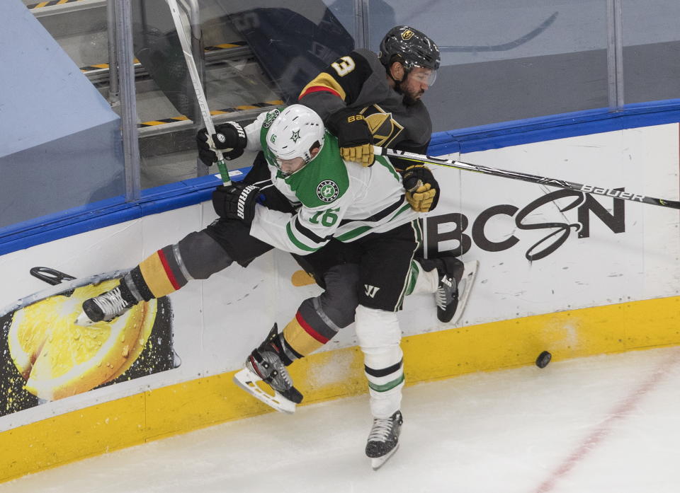 Dallas Stars' Joe Pavelski (16) checks Vegas Golden Knights' Alec Martinez (23) during the third period of Game 2 of the NHL hockey Western Conference final, Tuesday, Sept. 8, 2020, in Edmonton, Alberta. (Jason Franson/The Canadian Press via AP)