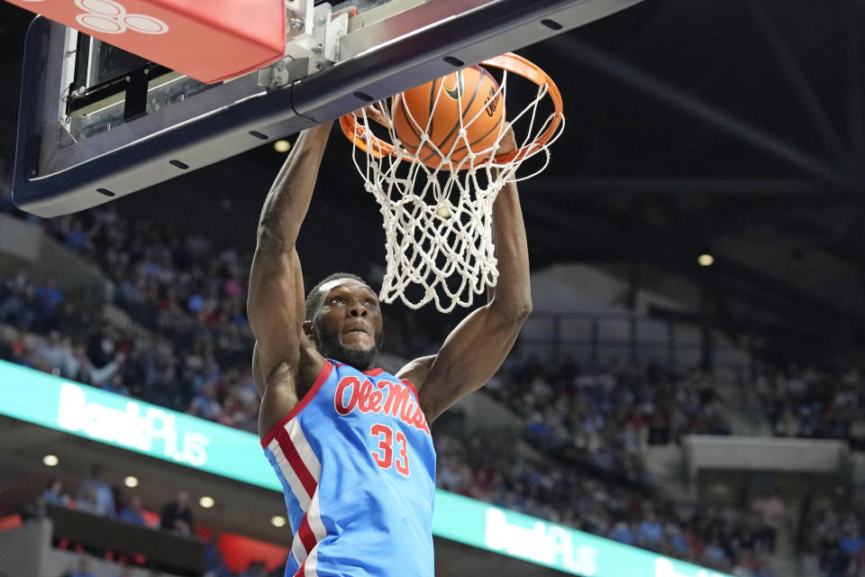 Mississippi forward Moussa Cisse (33) watches his dunk go through the net during the second half of an NCAA college basketball game against Auburn, Saturday, Feb. 3, 2024, in Oxford, Miss. (AP Photo/Rogelio V. Solis)