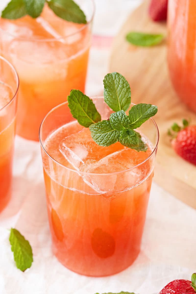 <p>Freshly squeezed lemons team up with juicy strawberries for the perfect summer drink. It's tart, sweet, and all around refreshing. Be sure to strain the strawberry puree as you'll get rid of seeds and excess pulp. Mint adds a nice brightness. but is totally optional! </p><p>Get the <a href="https://www.delish.com/uk/cocktails-drinks/a33333158/easy-strawberry-lemonade-recipe/" rel="nofollow noopener" target="_blank" data-ylk="slk:Strawberry Lemonade;elm:context_link;itc:0;sec:content-canvas" class="link ">Strawberry Lemonade</a> recipe.</p>