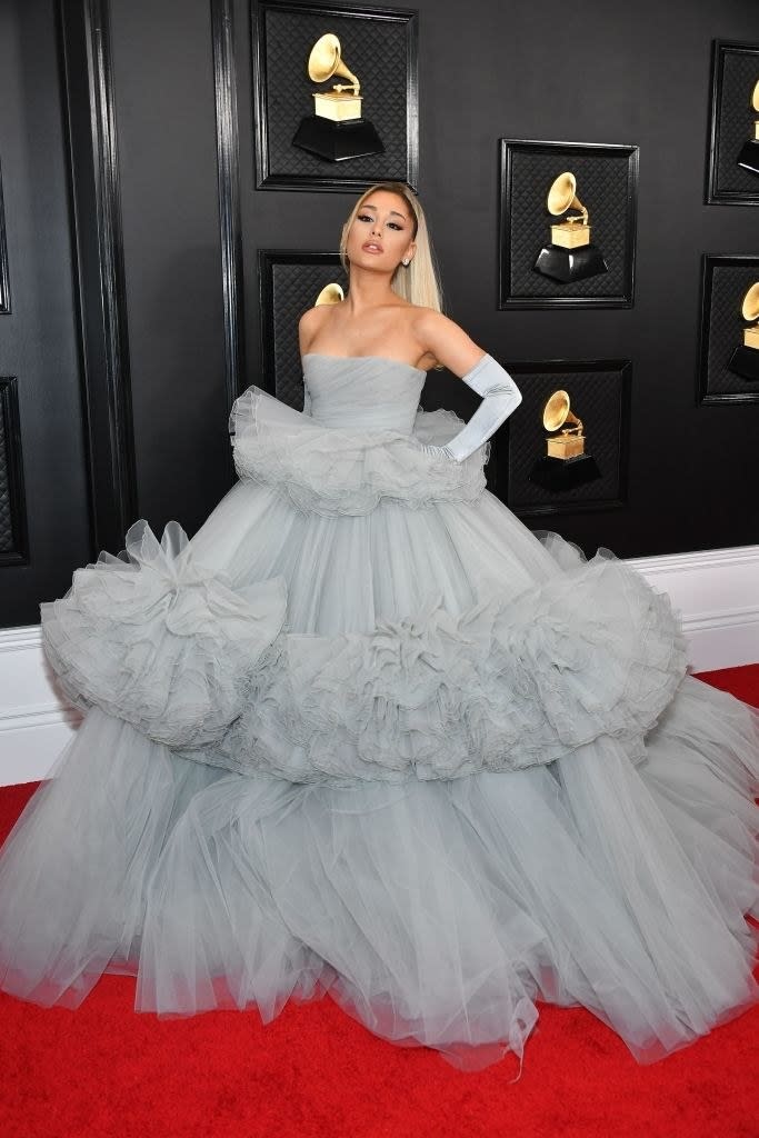 a dreamy, sleeveless ballgown with a giant tiered skirt, worn with opera gloves