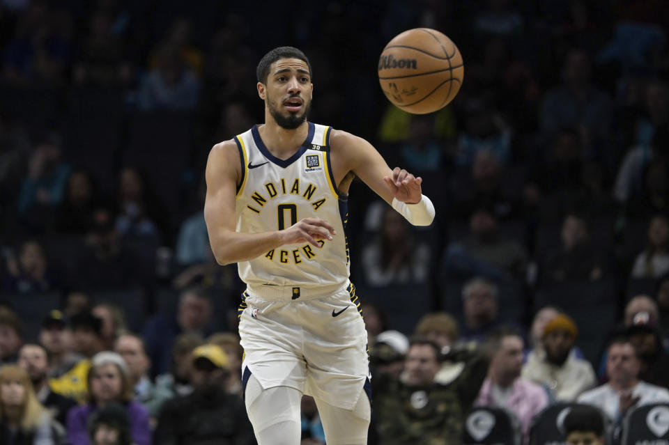 Indiana Pacers guard Tyrese Haliburton passes the ball upcourt during the first half of an NBA basketball game against the Charlotte Hornets, Sunday, Feb. 4, 2024, in Charlotte, N.C. (AP Photo/Matt Kelley)
