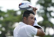 Hideki Matsuyama of Japan dries his sweat on10th hole during the second round of the men's golf event at the 2020 Summer Olympics on Friday, July 30, 2021, at the Kasumigaseki Country Club in Kawagoe, Japan. (AP Photo/Matt York)