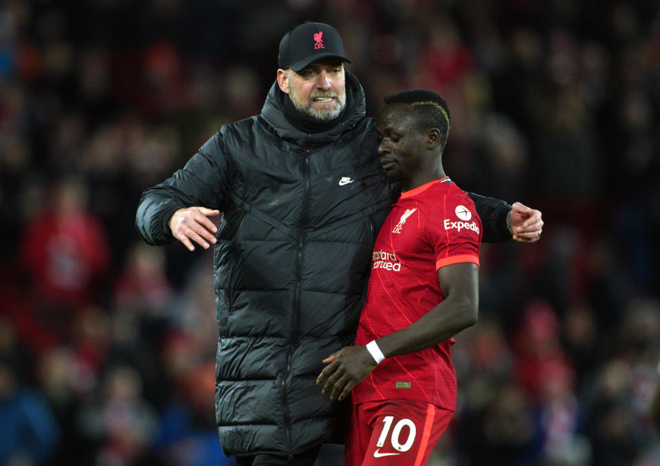 Liverpool manager Jurgen Klopp greets Sadio Mane after the final whistle following an English Premier League match at Anfield.