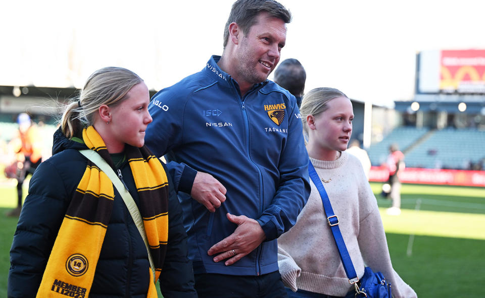 Sam Mitchell, pictured here with daughters Emmerson and Scarlet.