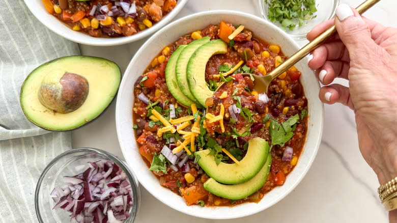 spooning out some chili