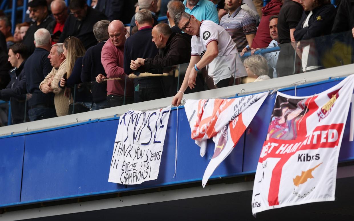 West Ham United fan displays a banner referencing West Ham United manager David Moyes