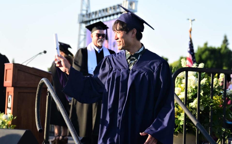 Merced College graduate Katsuya Sasaki makes his way off the stage after receiving his degree during the school’s 60th commencement ceremony on Friday, May 26, 2023.
