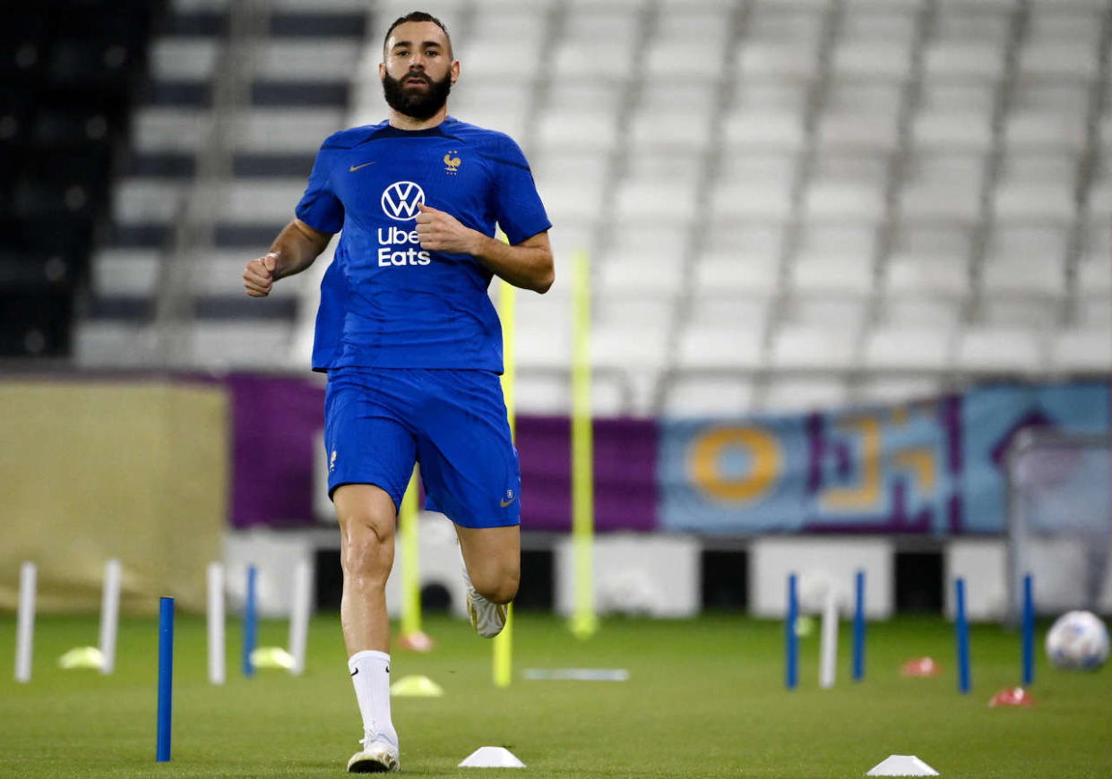 (FILES) In this file photo taken on November 17, 2022, France's forward Karim Benzema runs during a training session at the Jassim-bin-Hamad Stadium in Doha, ahead of the Qatar 2022 World Cup football tournament. - Karim Benzema left a training session injured on November 19, 2022. He is to receive medical examinations to determine the nature and severity of his injury, prior to the FIFA World Cup match against Australia on November 22. (Photo by FRANCK FIFE / AFP)