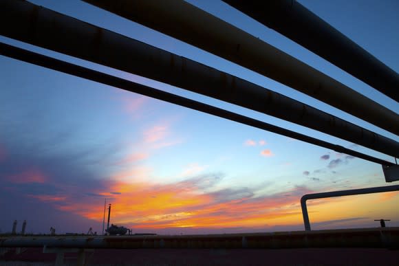 Pipelines with the sun setting in the background.