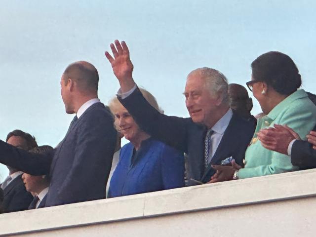 Charles and Camilla wave to the crowds (The Independent)