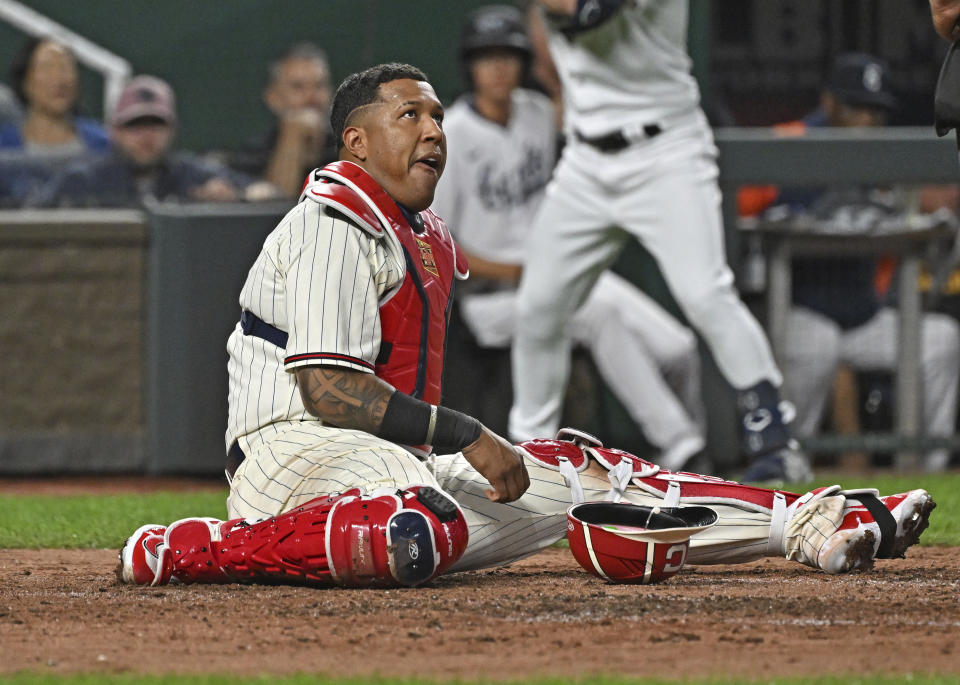 Kansas City Royals catcher Salvador Perez reacts after taking a foul ball off the mask during the fifth inning of a baseball game against the Houston Astros, Saturday, Sept. 16, 2023, in Kansas City, Mo. (AP Photo/Peter Aiken)