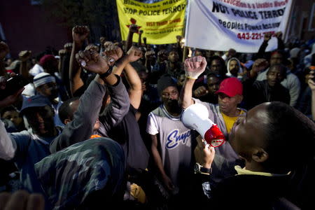 Demonstrators protest outside of the Baltimore Police Department's Western District police station during a rally for Freddie Gray, in Baltimore, April 21, 2015. REUTERS/Jose Luis Magana