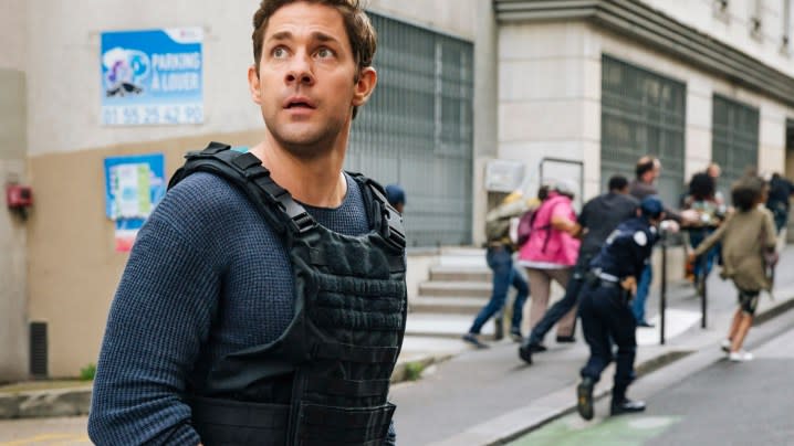 John Krasinski as Jack Ryan wears a vest in the Prime Video adaptation.