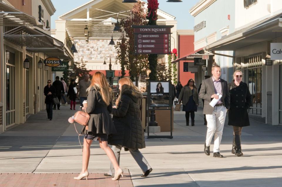 <span class="icon icon--xs icon__camera">  </span> <span class="credit font--s-m upper black"> <b>AVI STEINHARDT</b> </span> <div class="caption space-half--right font--s-m gray--med db">Shoppers peruse the stores at the Gloucester Premium Outlets in Blackwood, N.J.</div>