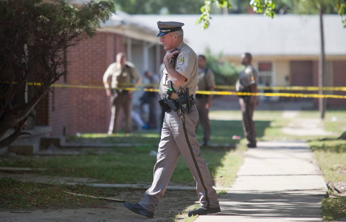 Wichita Police Officer Bob Bachman works a crime scene in north Wichita last summer. Bachman was a long-time member of the SWAT team and has been involved in two officer-involved shootings.